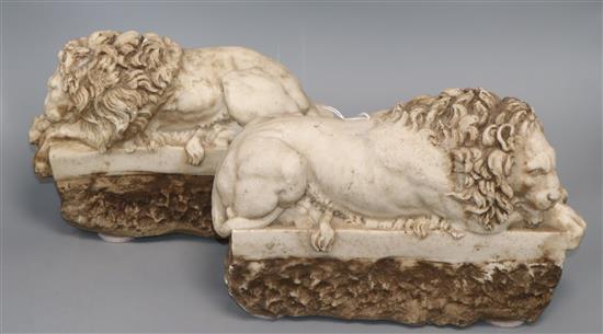 A pair of resin marble lions